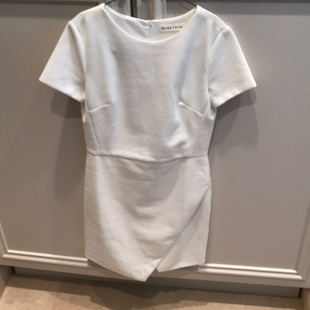 Brand new- never worn! Assymetrical bottom